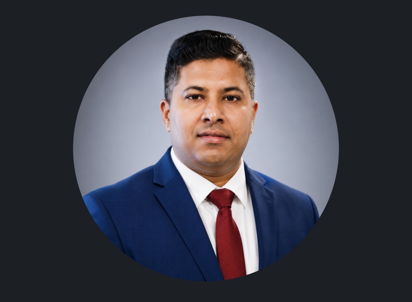 Professional portrait of Prem Kumar Perumal in a blue suit and red tie